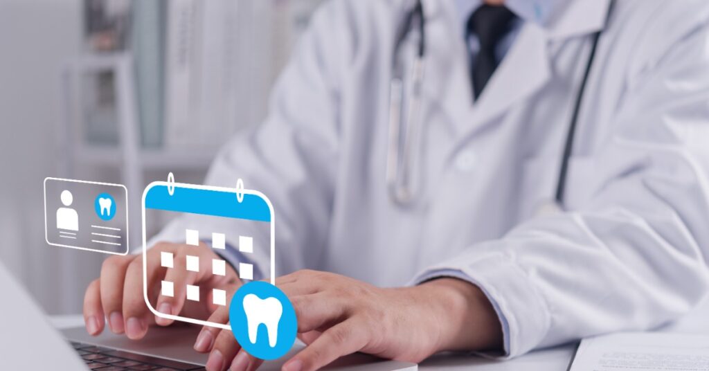 A person in a white coat types on a laptop. A digital calendar, profile card, and tooth icon floats above the keyboard.